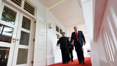North Korea's leader Kim Jong Un walks with US President Donald Trump at the start of their historic US-North Korea summit. Saul Loeb / AFP
