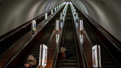 Civilians take shelter at a metro station during a missile attack in Kyiv. AFP