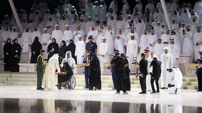 Sheikh Humaid bin Rashid Al Nuaimi, Ruler of Ajman and Supreme Council Member, in the presence of Sheikh Theyab bin Mohamed bin Zayed, Deputy Chairman of the Presidential Court for Development and Fallen Heroes' Affairs, on Commemoration Day at Wahat Al Karama in Abu Dhabi