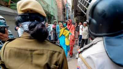 A woman shouts at security personnel on the streets in Shaheen Bagh area in New Delhi, India. AFP