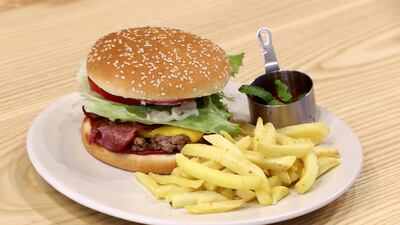 The IT burger is a popular dish and also found in the "naughty" section. Its featured ingredients are turkey bacon, ground beef, lettuce, tomatoes and avocado. Chris Whiteoak / The National