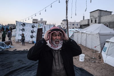 A displaced Palestinian man prays before breaking the fast on the first day of Ramadan, in Rafah, in the southern Gaza Strip. AFP
