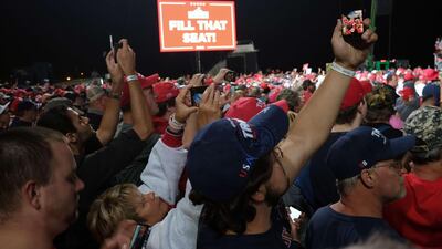 People listen as President Donald Trump speaks at a rally at Harrisburg International Airport after announcing Amy Coney Barrett as his choice to be the new Supreme Court justice. AFP