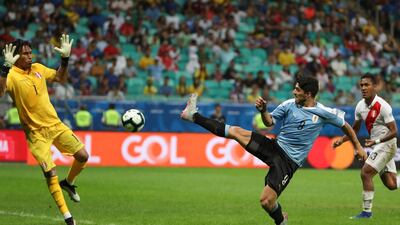 Luis Suarez has a shot on goal blocked by Peru goalkeeper Pedro Gallese. AP Photo