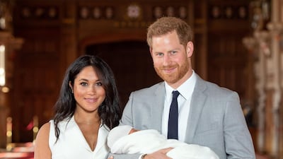 Prince Harry and Meghan, Duchess of Sussex, pose with their newborn son Archie during a photocall at Windsor Castle on May 8, 2019 in Windsor, England. Getty Images