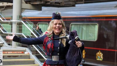 Piper Louise Marshall awaits their arrival at Edinburgh Waverley Station. Reuters