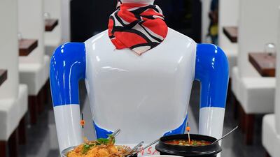 A service robot carries food in a tray for customers on the opening day of the "Robot" restaurant in Bangalore on August 17, 2019. Photo: AFP