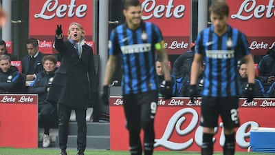 This file photo taken on January 24, 2016 shows Inter Milan's manager Roberto Mancini gesturing during an Italian Serie A match against Carpi at San Siro Stadium in Milan. Inter Milan said on August 8, 2016 its coach Roberto Mancini is leaving, citing a "mutual agreement" amid media reports the Serie A club's new Chinese owners decided fresh blood is needed to rejuvenate the team. AFP / GIUSEPPE CACACE