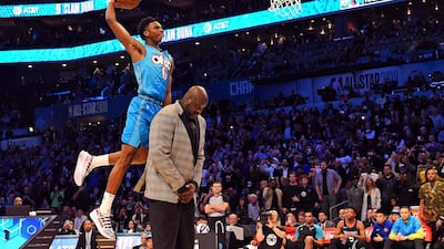 Oklahoma City Thunder forward Hamidou Diallo dunks over Shaquille O'Neal in the Slam Dunk Contest during the NBA All-Star Saturday Night at Spectrum Center. Bob Donnan/USA TODAY Sports