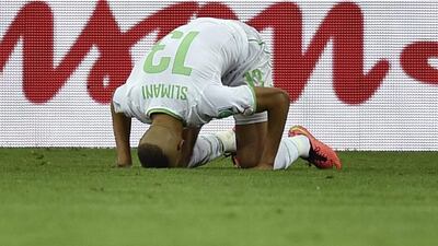 Islam Slimani shown after scoring his side's lone goal in a 1-1 draw with Russia on Thursday night at the 2014 World Cup that put them through to the last-16 of the tournament. Martin Meissner / AP / June 26, 2014