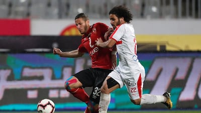 Al Ahly's Ramadan Sobhi in action with El Zamalek's Abdallah Gomaa. Reuters