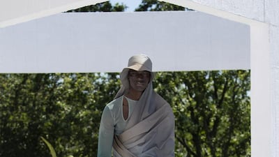 Cloth extending from the hat has been wrapped into a top, as part of the Qasimi spring / summer 2022 collection. Courtesy Qasimi