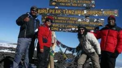 Leela Alvares, second from left, with climbing companions at Uhuru Peak, the highest point on Mount Kilimanjaro, which she climbed to raise funds for Emirates Arthritis Foundation.