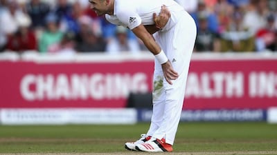 James Anderson of England holds his side before leaving the ground with an injury during day two of third Ashes Test. Ryan Pierse / Getty Images