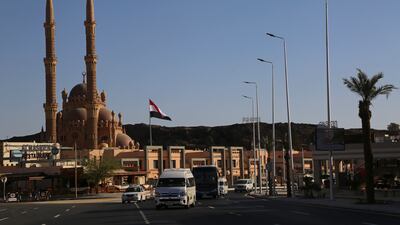The Egyptian flag flies in the Old Market of Sharm El Sheikh ahead of the summit.