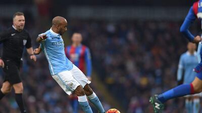 Manchester City’s Fabian Delph shoots and scores the opening goal on Saturdya against Crystal Palace in the Premier League. Peter Powell / EPA