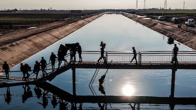 People flee a formerly Kurdish-controlled area of Aleppo, in Syria. Getty images