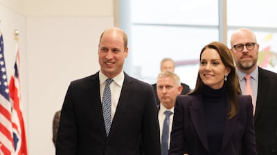 To arrive in Boston with Prince William, she wore a navy Alexander McQueen leaf crepe suit jacket with co-ordinating trousers on November 30, 2022. AFP