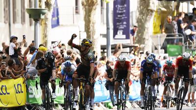 French rider Christophe Laporte of Jumbo Visma celebrates after crossing the finish line to win the 19th stage of the Tour de France 2022. EPA