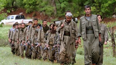 A group of armed Kurdish fighters from the Kurdistan Workers Party enter northern Iraq in the Heror area, northeast of Dahuk. The PKK came to the rescue of the persecuted Yazidi minority in 2014, but they are regarded as a terrorist group by Turkey. Ceerwan Aziz / AP