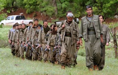 A group of armed Kurdish fighters from the Kurdistan Workers Party enter northern Iraq in the Heror area, northeast of Dahuk. The PKK came to the rescue of the persecuted Yazidi minority in 2014, but they are regarded as a terrorist group by Turkey. Ceerwan Aziz / AP