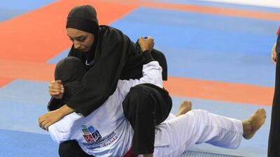Alyazyah Al Shehyari (in black) on her way to winning the gold medal against Mariam Al Meqbaali. 21 November 2015 - Photo courtesy UAEJJF