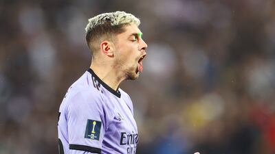 A laser beam hits the face of Real Madrid's Federico Valverde as he celebrates scoring their second goal. Getty
