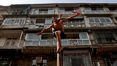 A boy performs traditional Indian malkhamb gymnastics during the Gudi Padwa festival, which celebrates the beginning of the new year for Maharashtrians, in Mumbai, India. Reuters