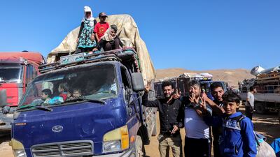 Syrian refugees waiting to be evacuated from their refugee camps in the village of Arsal, Lebanon. EPA