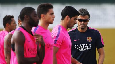 Luis Enrique, right, says Barcelona have the desire after ending last season trophy-less. Emilio Morenatti / AP Photo