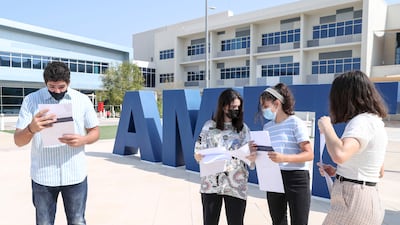 Pupils Kareem Baloawi, 16, Rahaf Teggaz, 16, Maram Chetioui, 15, and Fransio Van Ravenswaay, 16, receive their GCSE results after a long summer of anticipation at Amity International School Abu Dhabi