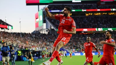Nizar Al Rashdan celebrates after scoring against Algeria. Reuters