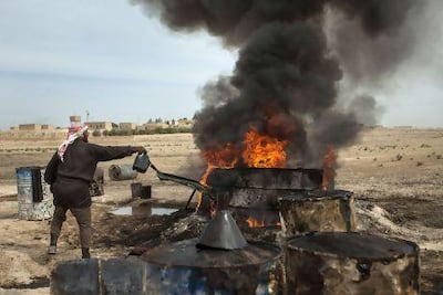 A farmer refining crude oil in Raqqa at the height of the eight-year war in Syria