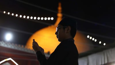 A boy prays during Ramadan in Karachi, Pakistan. EPA