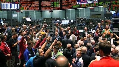 Traders signal offers in the S&P 500 stock index futures pit at the Chicago Board of Trade. Scott Olson / Getty Images / AFP