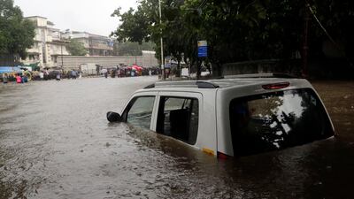 Rising waters in Mumbai which have devoured human beings as well as vehicles and buildings. Rajanish Kakade / AP Photo