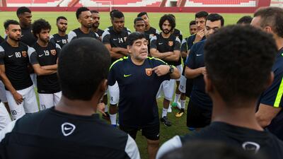Fujairah manager Diego Maradona talks to his squad during a training session. Christopher Pike / The National