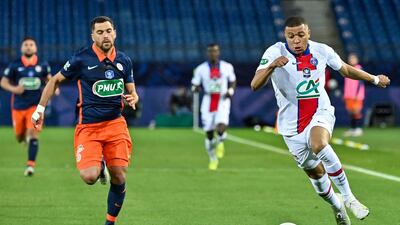 Paris Saint-Germain's French forward Kylian Mbappe runs with the ball. AFP