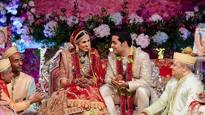 Akash Ambani and Shloka Mehta smile as they perform a ritual at their wedding ceremony in Mumbai, India, in March 2019. Courtesy Reliance Industries Limited