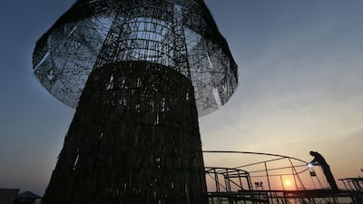 Hundreds of Sri Lanka's port workers and volunteers are struggling to put up the towering Christmas tree in time for the holidays. Eranga Jayawardena/AP Photo
