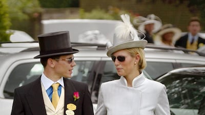 Zara Phillips, wearing a silver dress and hat, with then-boyfriend Richard Johnson arrive for Ladies Day at Royal Ascot on June 20, 2002. Getty Images