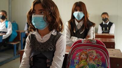 Girls sit in class on the first day of school in the camp for displaced people in Sharya.
