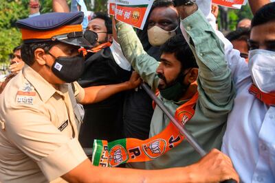 Bharatiya Janata Party supporters scuffle with police while protesting against the arrest of TV anchor Arnab Goswami in Mumbai on November 4, 2020. AFP