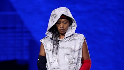 Naomi Osaka also wore a headband over cornrows and wore a sweatband on one arm and a sleeve on the other. The look was a homage to former NBA star Allen Iverson. AFP