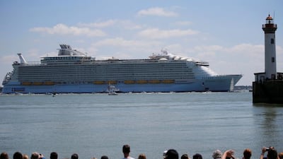 The Harmony of the Seas is pulled away from a shipyard in Saint-Nazaire as thousands of people look on. Stephane Mahe / Reuters