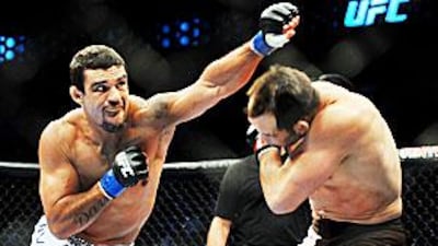 Vitor Belfort, left, is training hard and staying relaxed ahead of his fight with Anderson Silva.