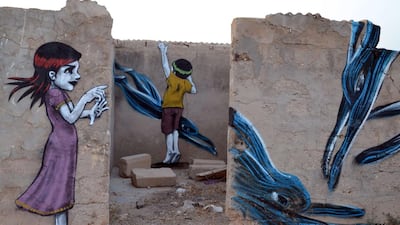 Graffiti decorates the walls of an abandoned building. F Nasri / AFP Photo