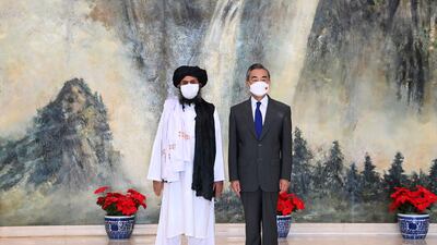 Taliban co-founder Abdul Ghani Baradar and Chinese Foreign Minister Wang Yi pose for a photo during their meeting in Tianjin, China, last month. Image: AP