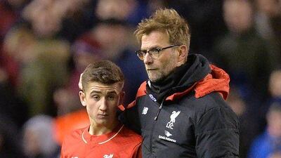 Liverpool manager Jurgen Klopp, right, speaks with midfielder Cameron Brannagan after the end of the English FA Cup fourth round football match against West Ham United at Anfield in Liverpool, north west England, on January 30, 2016. AFP / PAUL ELLIS
