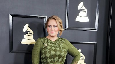 2017: Adele stuns in this green Givenchy gown for the 59th annual Grammy Awards. EPA